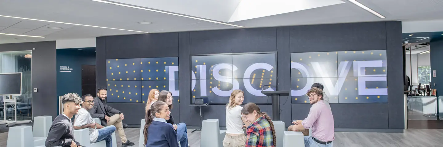 A group of students smiling and enjoying an event.
