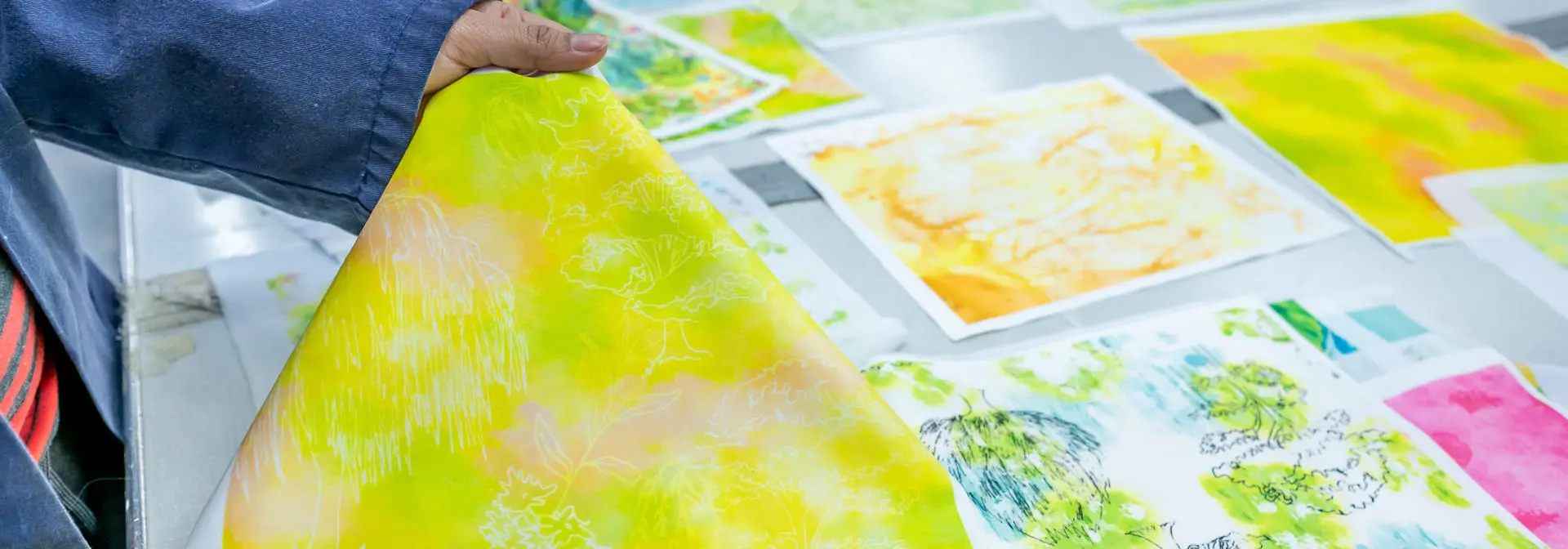 Multiple prints of flowers and abstract design in green and yellow colours.